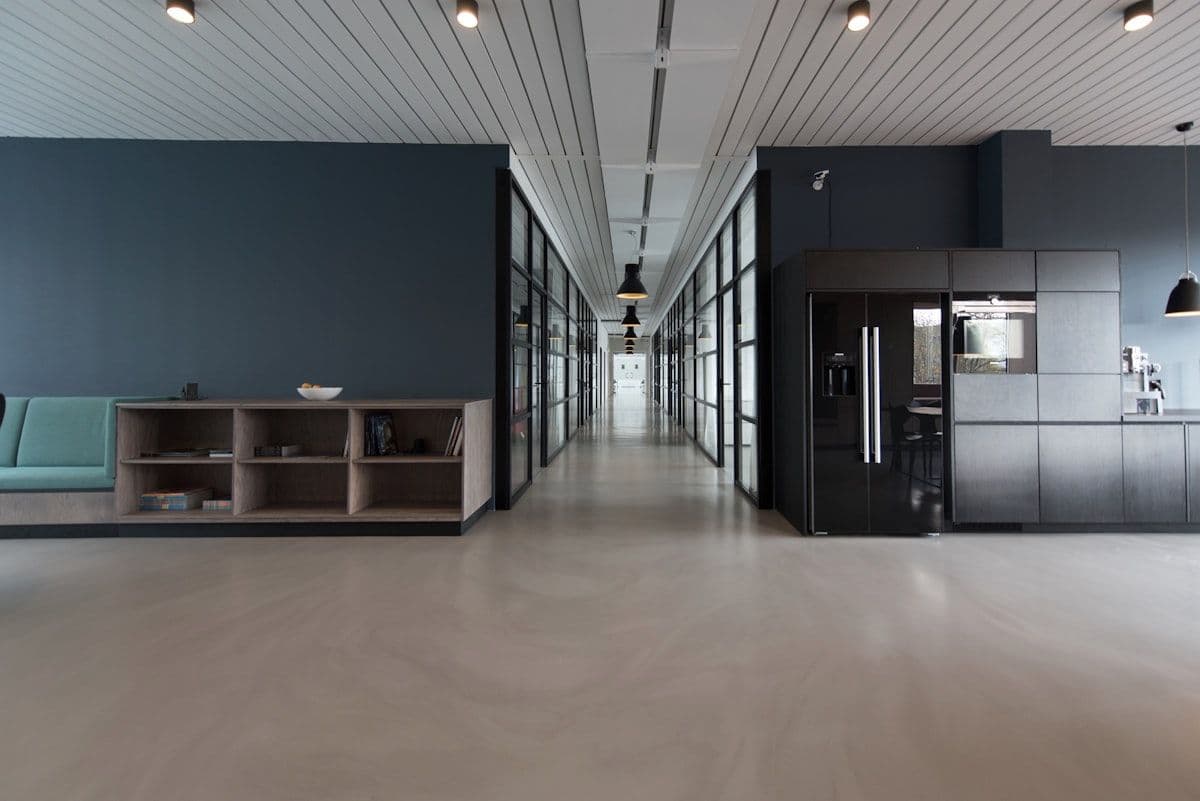 Modern executive office interior with desk and American flags