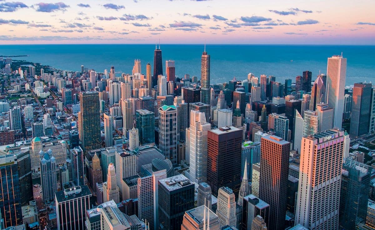 Aerial view of a major American city skyline at dusk
