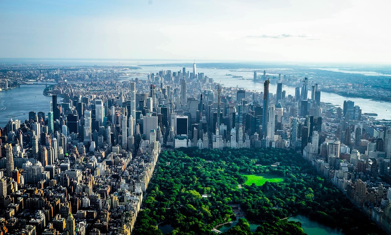 New York City skyline at dusk featuring Midtown Manhattan skyscrapers and the financial district